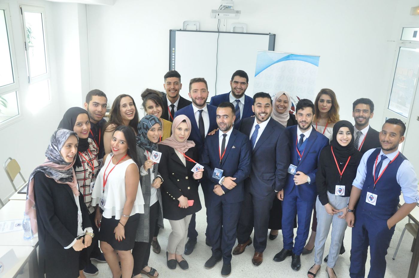 Diploma participants in a group photo in the training room