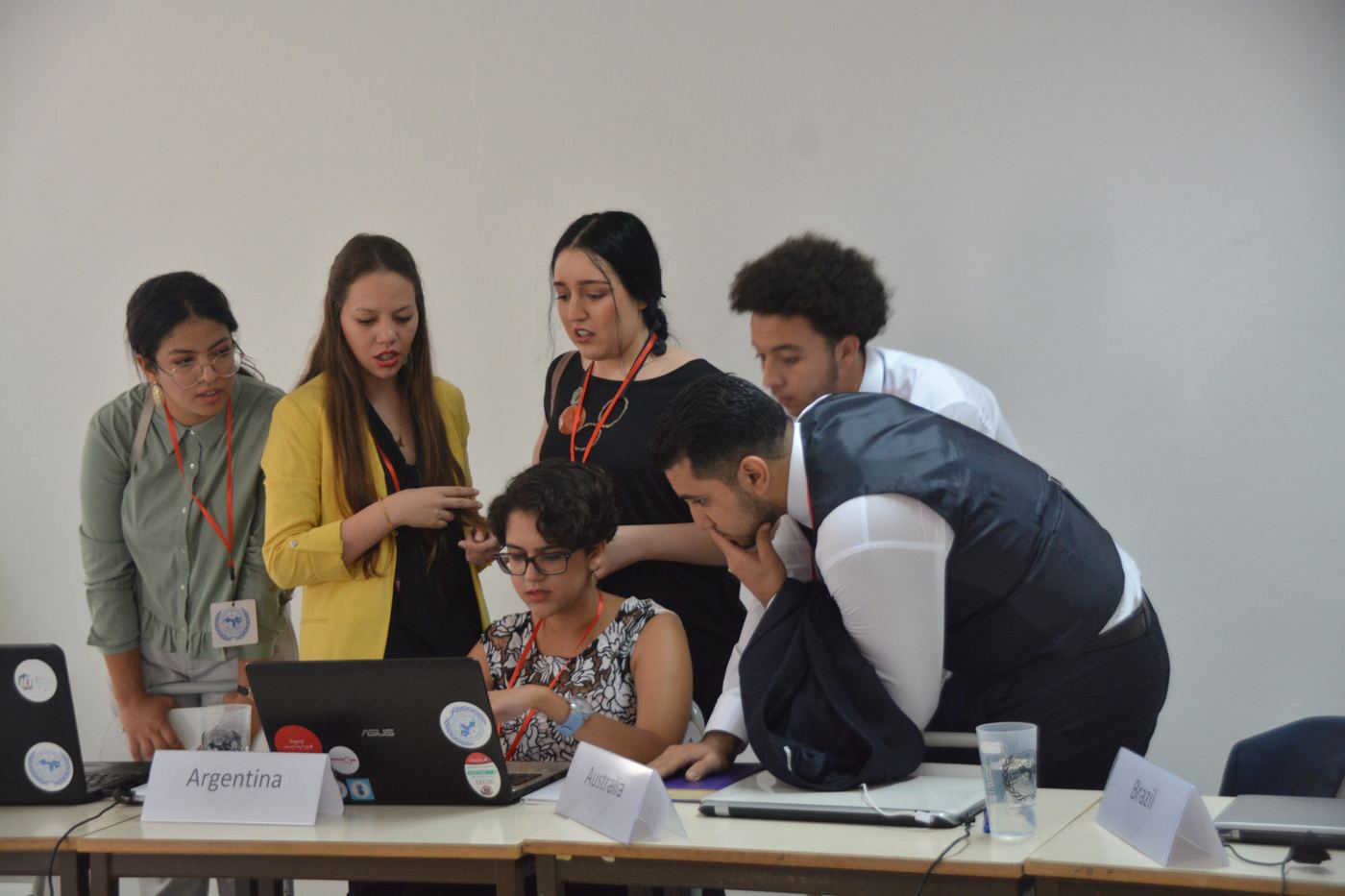 A small group working together at a laptop