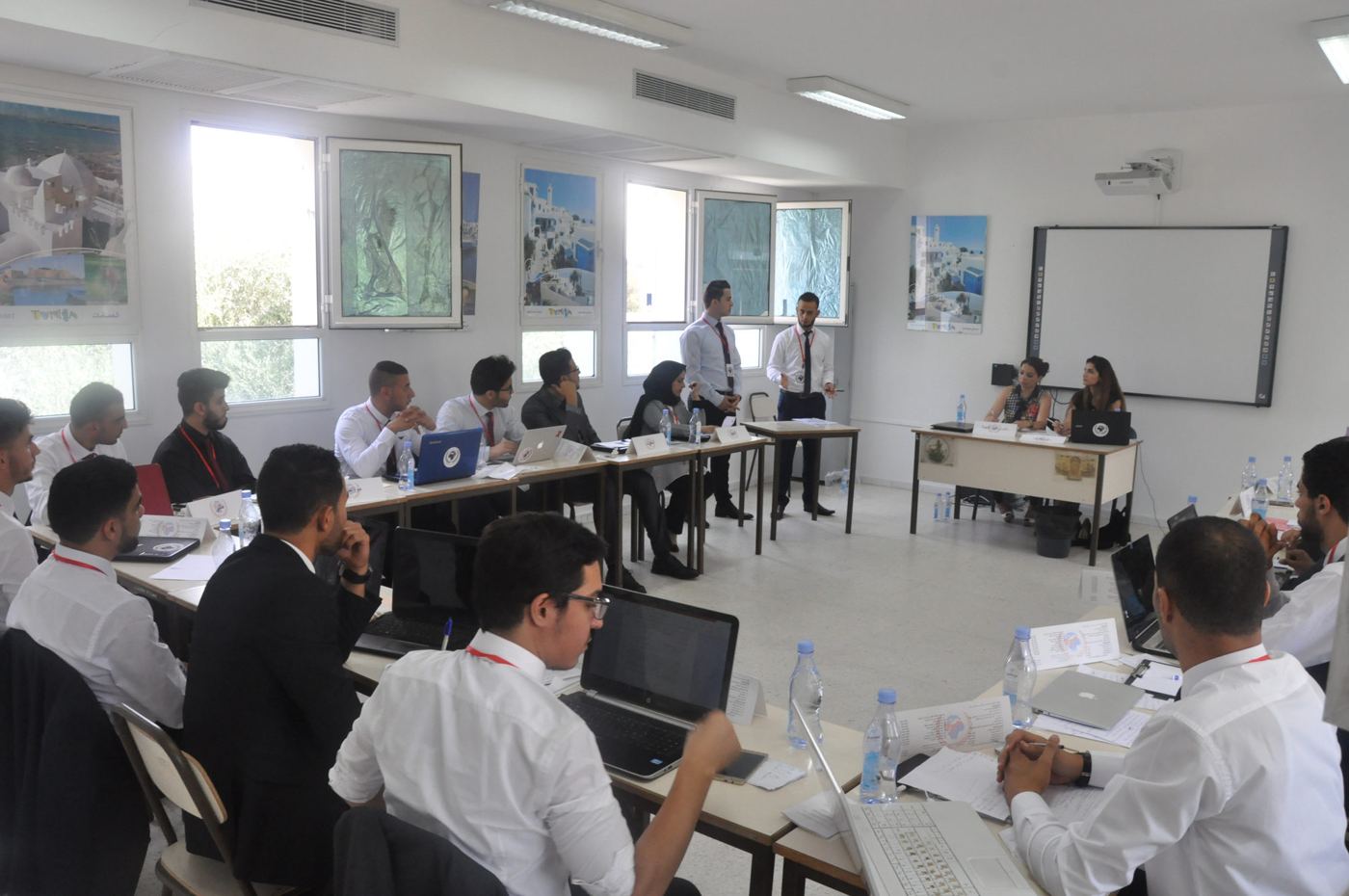 Delegates at their desks during a MENAMUN committee session
