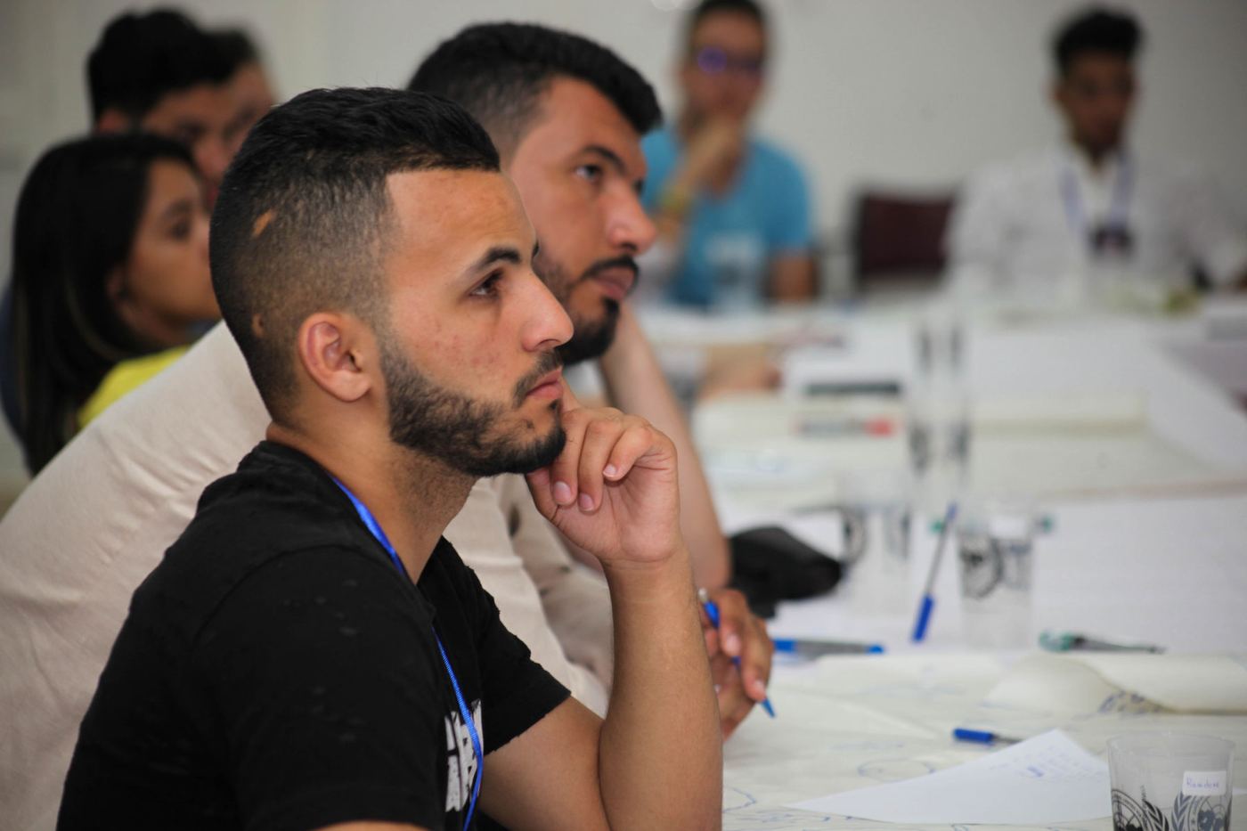 A participant listening closely during a session