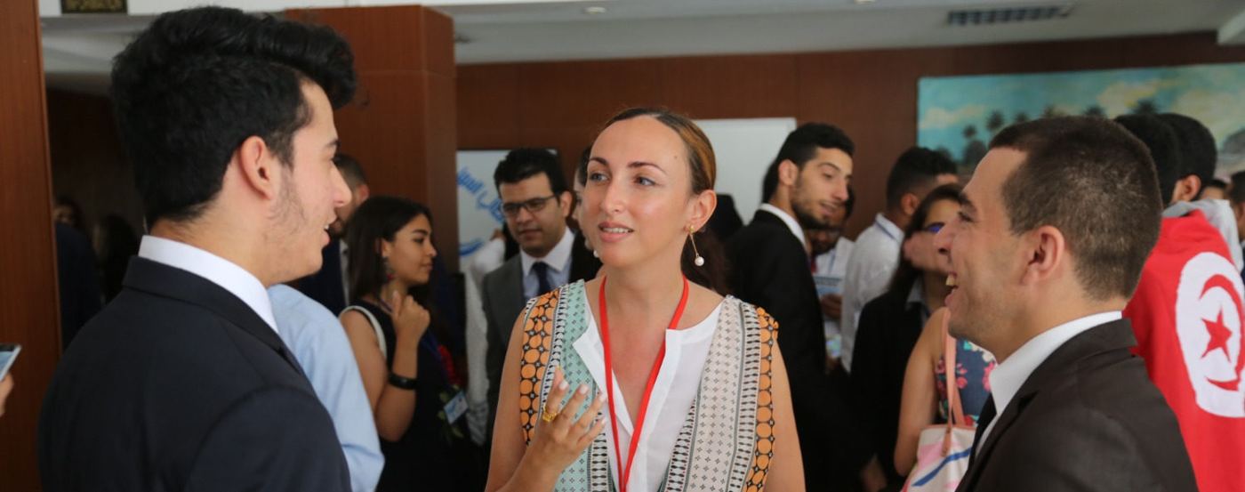 Participants in conversation during a conference break