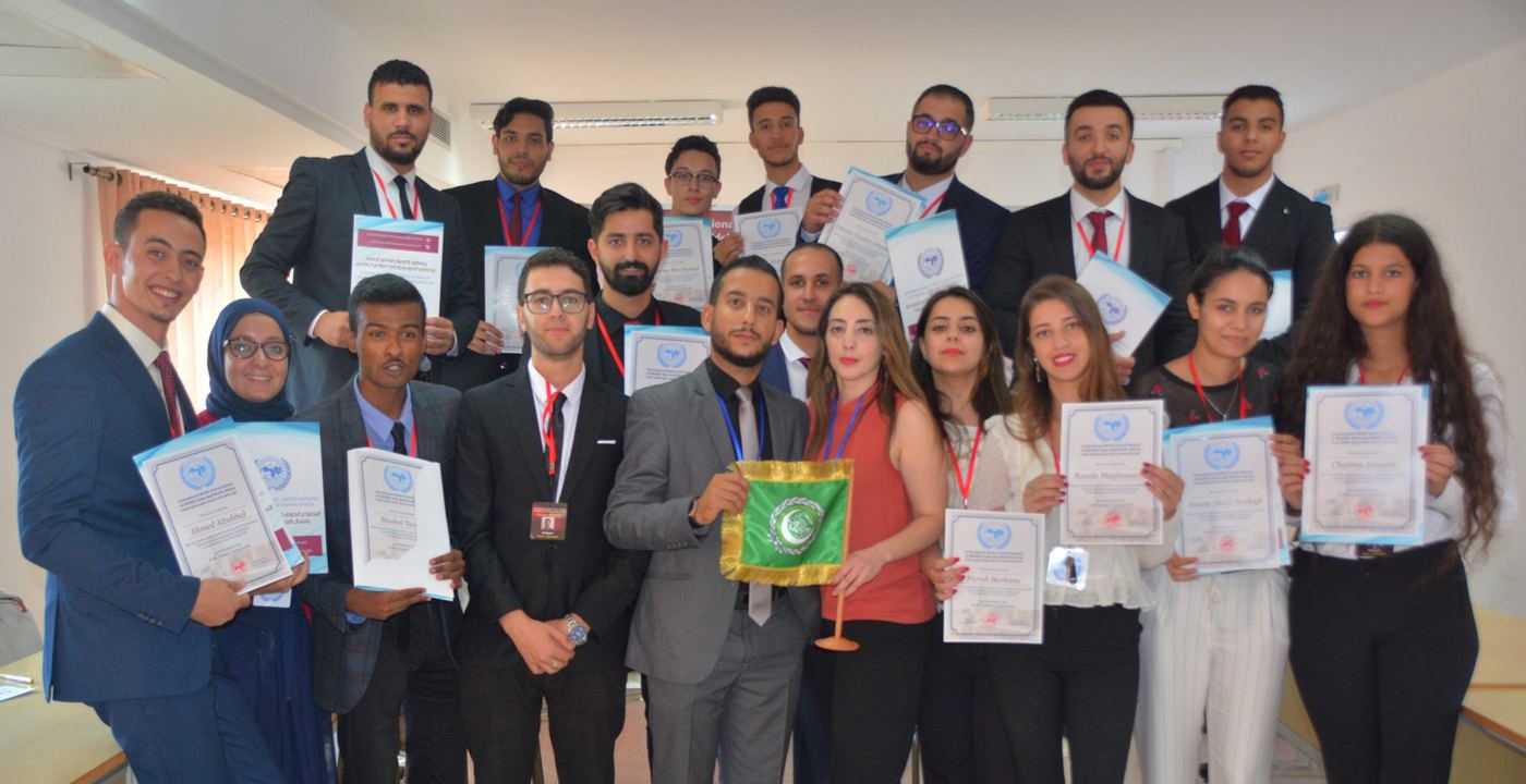 A group of participants holding their certificates